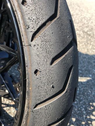Stock front tire was taking everything I threw at it. Stuck just fine. 