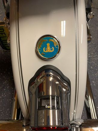 a motodog69 challenge coin holder covers the three holes just right and let me add some personalized stuff to the sled.