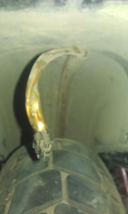 Harness is glued under rear fender