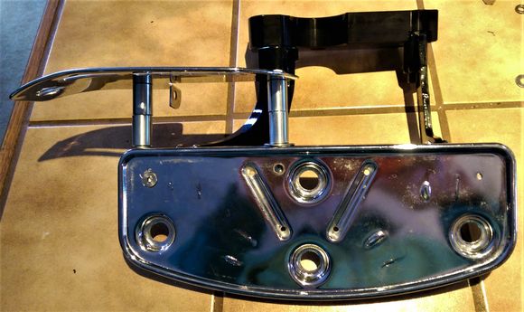 Extended the heel guard with a couple of 1" spacers.  Couldn't find stainless, so I spun the plated ones I got on the lathe and polished and shot them with some clear.  5/16" bolt front, 1/4" back.  You can see the flat head bolt for the back mounting block.  You can see the outer bracket attached.