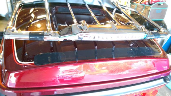 There's a couple of layers of vinyl window cling on the tour pack at the places the assembly pads sit to protect the paint; zero scuffing.  Cut the ty-wraps, remove the assembly,  There are a couple of layers of black electrical tape on the rack where the assembly sits on it partially, or where the ty-wraps hold one to the other.
