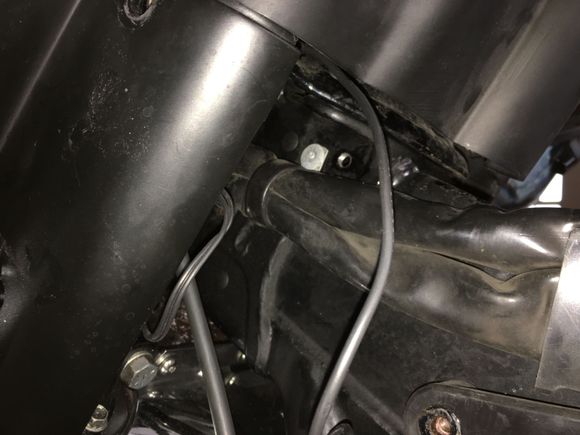 Pre-existing hole I taped for a 5/16x18 screw.