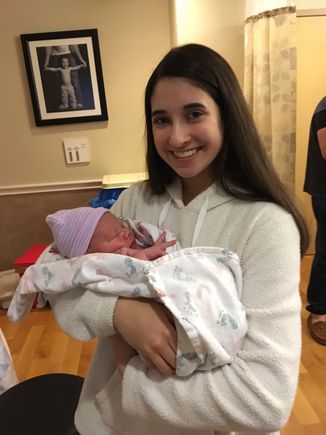 With her big sister.