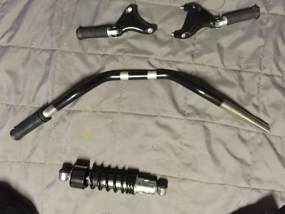 Stock sportster 48 handlebars. There is a stock grip on the left side.