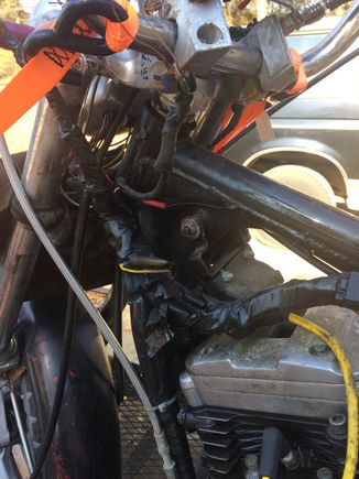 A cut off threaded rod holding the front of the tank and the mounting brace was liquid nailed on..