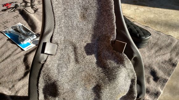 Notice the rubber pads. The one on the right is cover the metal park that poked through.