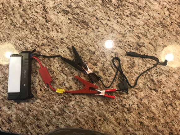 Carry on longer rides just in case.  this will charge the battery with the standard tender and jump pack cables.