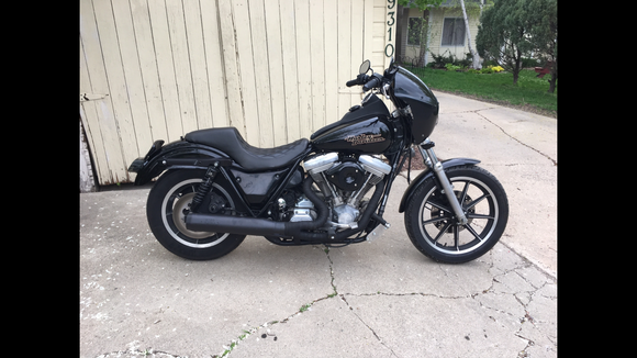 Here its is mocked up before the complete teardown.  100% LED lighting; Alloy Art strut mount r signals, joker 39mm mount f signals, 5 3/4" daymaker style headlight, custom dynamics tail light, bad lands load equalizer.  RSD seat, Ness side covers, stash tray and fairing, progressive 412 shocks, dyna 2000 programmable ign, BUB 2-1 exhaust and stage 3 motor rebuild.  Will be 100% blacked out, engine is done. Waiting on powdercoat for wheels, front end, primary covers and Tranny covers.