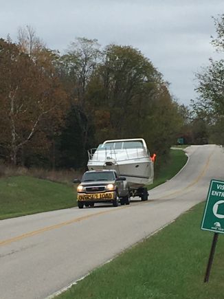 A pic a friend took when I hauled the 34 Baja home last fall. 12' beam, needed permit and signs to haul
