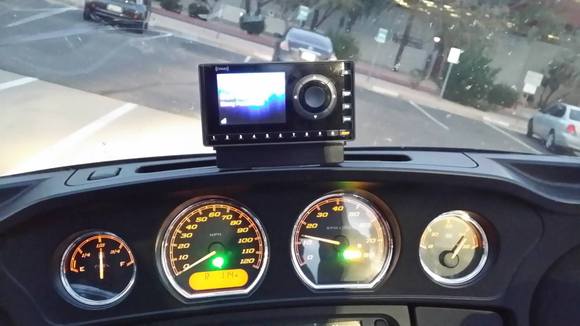 My XM ONYX mounted above the speedo and tack in front of the windshield vent hole