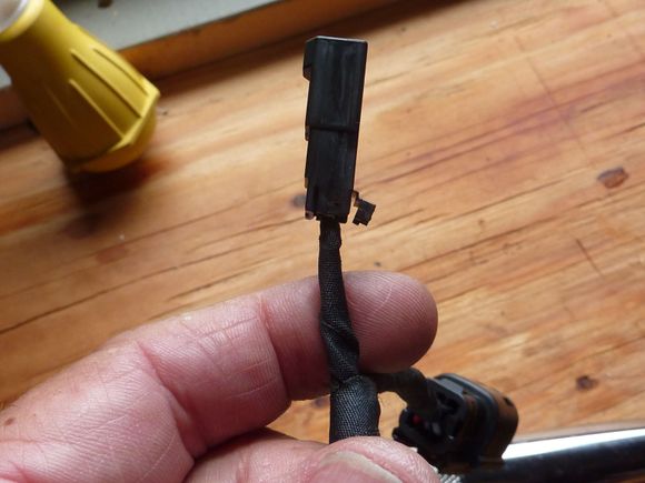 To remove the wires, pop the snap on the back of the plug open.