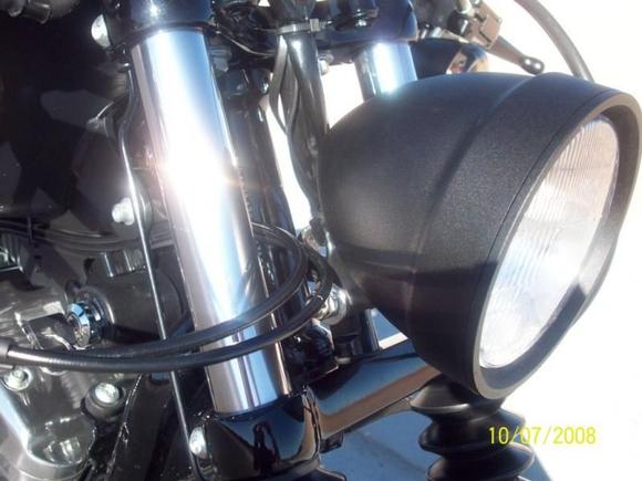 Bobber Style Headlight (comes in wrinkle black) A hole was drilled in the center of the tree, and my mount was custom, but you can find the light in JPcycles.com part # 310-475
( $125 )