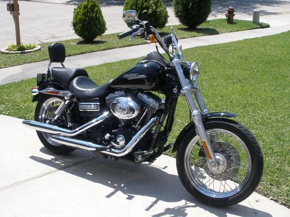 Added passenger seat/pegs, sissy bar, 2" tank lift, Hwy pegs and chrome battery trim band.