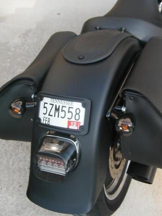 Flush mount Kuryakan license frame powder coated, Black smoke turn signal lens, Bright Ass LED (smoked) tail light, stock solo seat and fender bib. Powder coated the thumb screws for the bib.