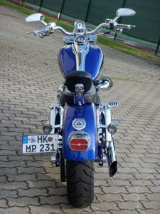 License plate relocation and two up LePera custom leather seat and Haulin' Ass sissy bar for my lovely ladies comfort.  I don't ride in this combo very often, but when she wants to ride it's only a 5 minute operation to convert to 2Up.