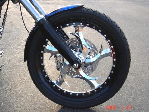 FRONT WHEEL - Right
21" Renegade Elite Multi-Piece (vs 19" Stock)
Matching Full-Floating Rotor
Powdercoated Fork Lowers
Chrome and Black Bolt Covers