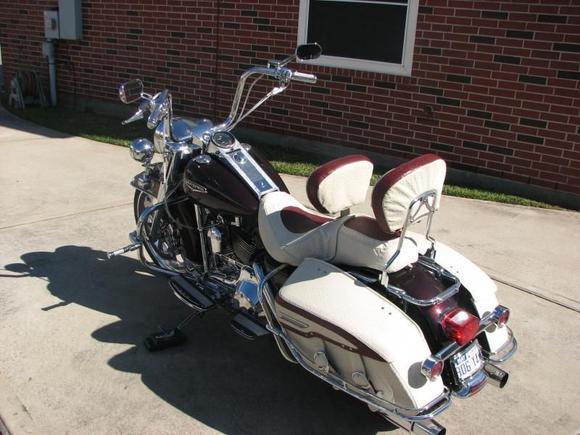 Here I add Cream/Burgundy Ostrich upholstery to the seats, saddle bags, and back rest.
