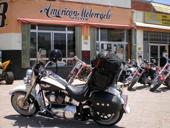 Of all places to find an American motorcycle service...Spain!  And a beach to boot!