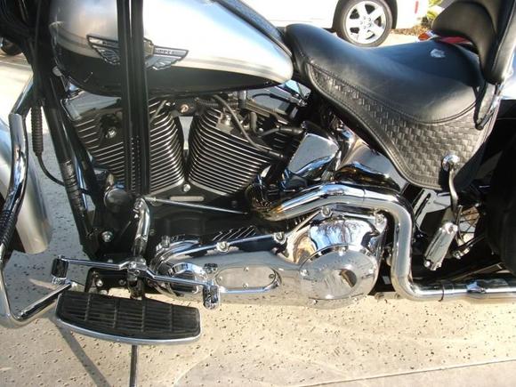 HD chrome shifter pegs and rear passenger pegs.  Kuryakyn swingarm cover.