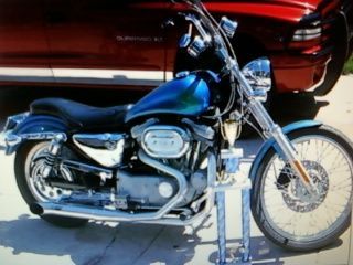 02 sportster, 883 converted 1230, stg 3 buell heads, cams, flat top pistons, ignition, and a RB racing LSR race pipe... 128hp on the ground. :-)