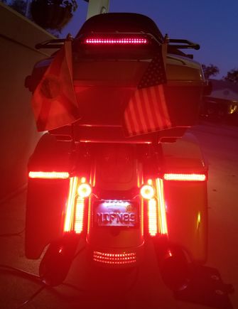 The H-D Tour-Pac luggage rack has the H-D lights, added later...you can see the difference.  Down below, everything (except the CD lit LP Frame) works as RUN/TURN/BRAKE with a CD strobe module.  Both night and day rear visability is now good.