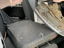 this shows the seat down exposing trunk behind passenger