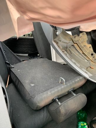 this shows the seat down exposing trunk behind passenger