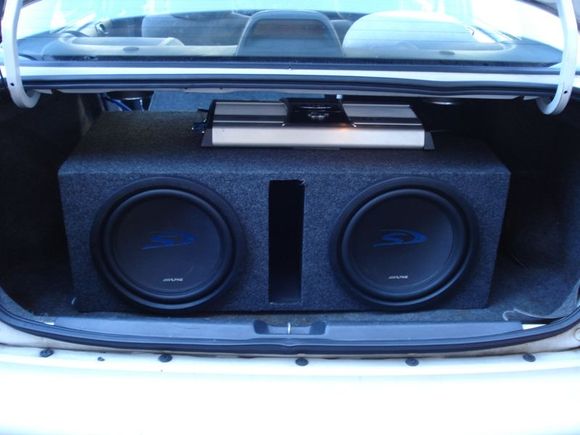 12" Alpine Subs, 1600 watt BOSS Amp. AND the BOX. u see that box! Specially for BASS