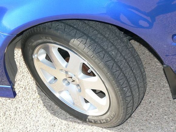 Original factory installed wheel and Michelin XGT V4.  (Front left side)  The back wheels and tires look just as good.