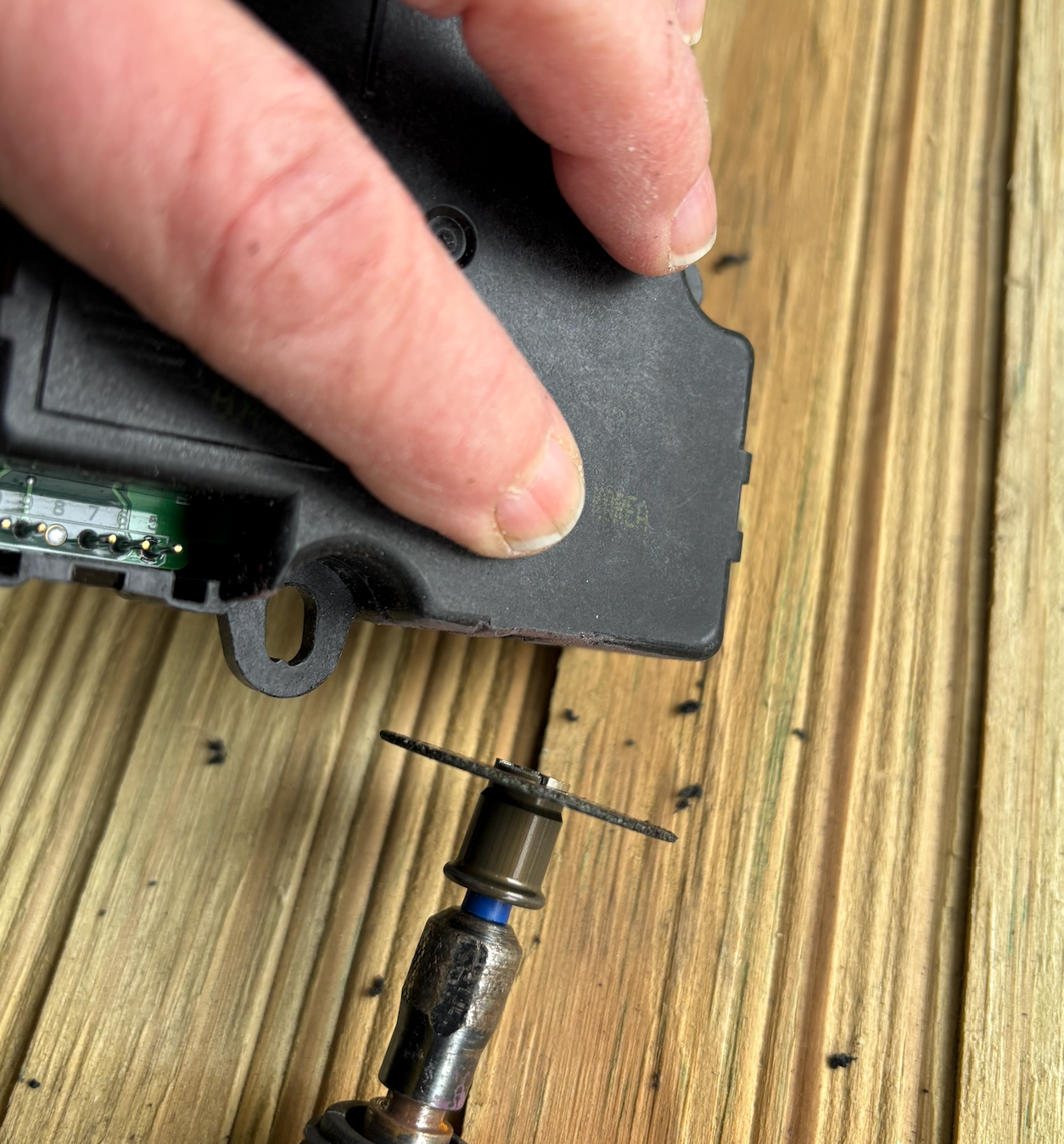I cut off the tab then ground off the rest of it followed by a quick sand,
