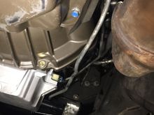 This shows trans cooler lines from back to front. Also has the catalytic converter installed to show proximity.