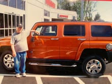 Dad in 2007 picking up his new H3X in Solar Flare Orange