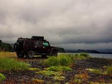 On the beach, photos of fishing trawlers near shore catching salmon