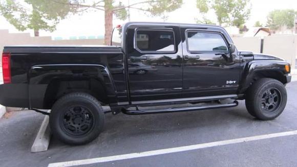 Flat black Liquid Metal wheels, black powder coat running boards, window tint
