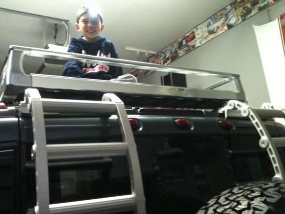 my son watchin the Yankees game on the roof of the H2