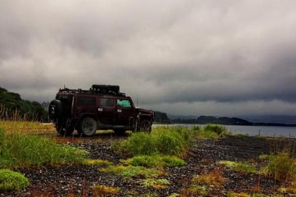 On the beach, photos of fishing trawlers near shore catching salmon