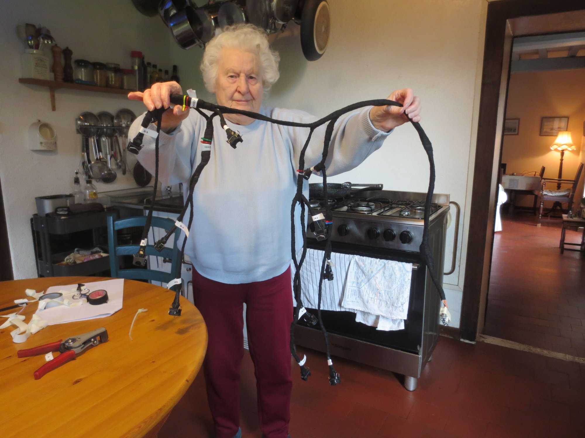 Madames mother is a great help on these occasions and here she is holding up the wrapped and completed loom she helped me finish today. Adhesive loom wrap works really well and makes a decent looking end product.