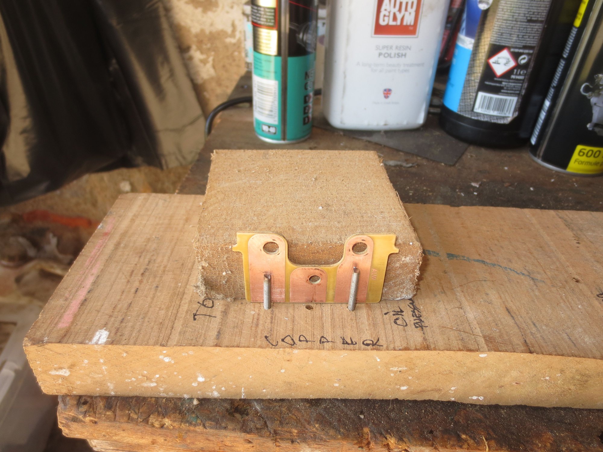 Jig for oil pressure guage board with clamping block in place