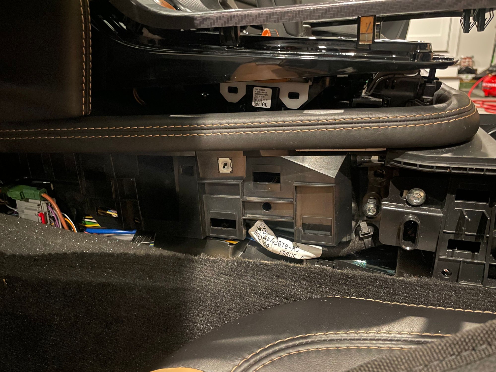 General picture to show layering of parts - top trim, switch module, center console 