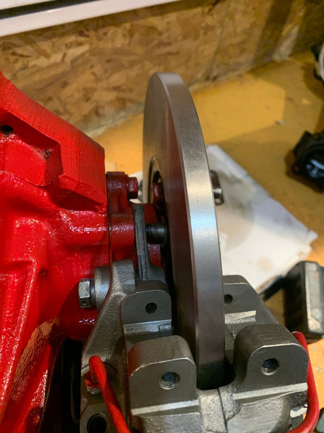 Caliper and disc first bolt 