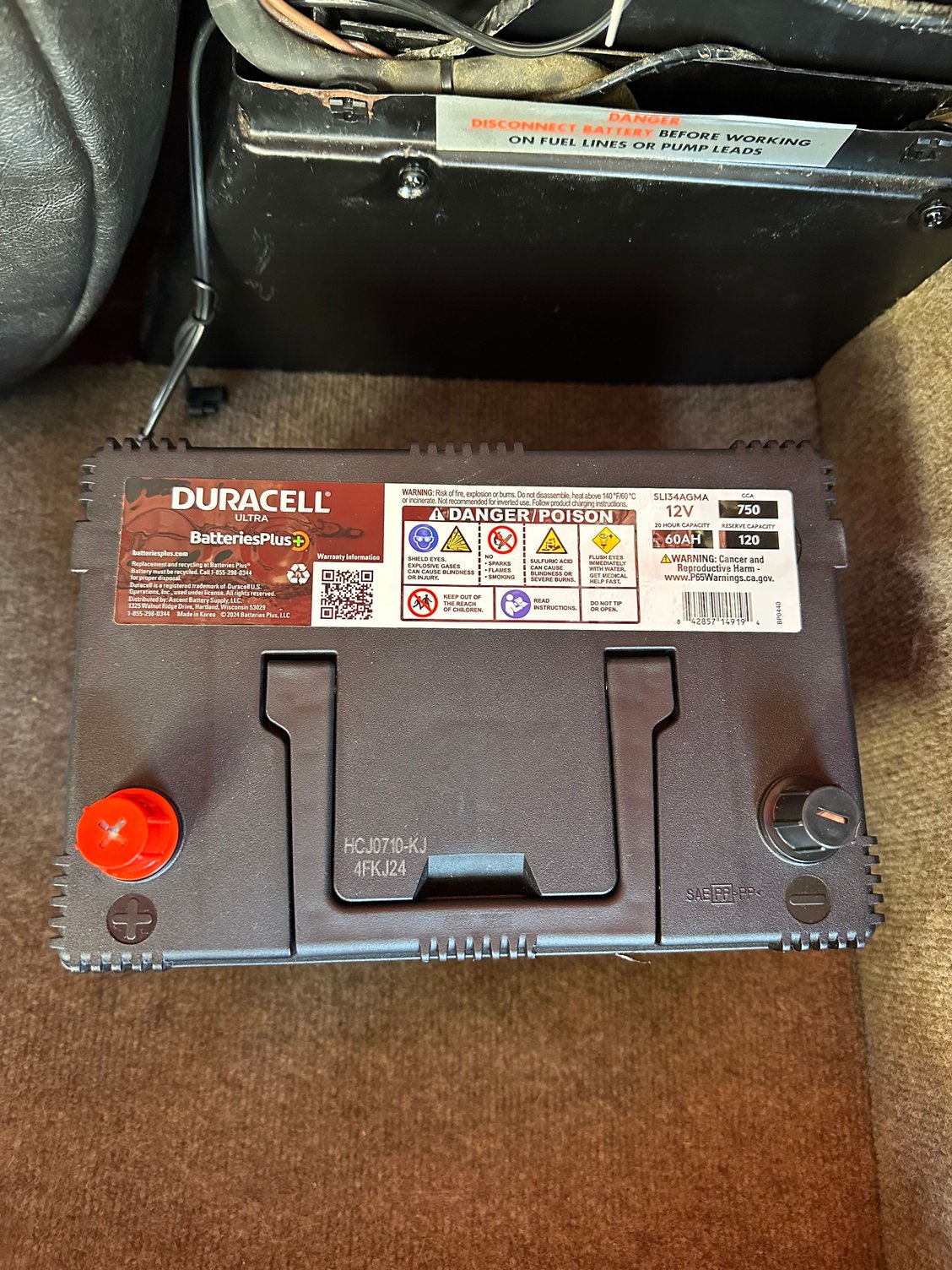 The handle on this battery was a huge help with getting this battery in place. It is heavy. 