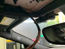 Put electrical tape on the bare roof metal to prevent any shorts to the garage remote board