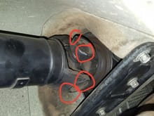 Areas of the Y flange of the u-joint that make contact with the undercarriage when driveshaft buckles under moderate acceleration.