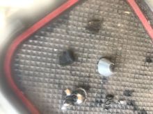 Metal shavings and two plastic pieces.