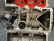 This is from a 3.0 V6 but since yours is an 8, this is all we got here. The photo shows 3 (circled) bolt holes but yours will have 4 on each side. Get those 8 bolts out. 