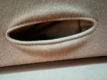 Pocket loosely tucked up inside. 