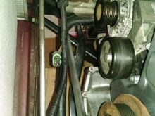 The crankshaft locking tool goes behind, and under, the swaybar.