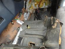 Sound deadening removed from front of footwell rotated 180 degrees so that the part number can be seen.