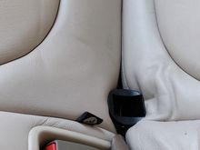 Black plastic guides for seat fixings (May be upside down but, after a struggle prising the cushions apart to fit, and as they work fine, I've left them as is.