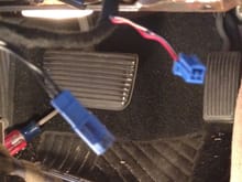This blue connector emanates from the ignition switch and terminates into the ignition switch cable. Portion of cable shows a red wire (can't tell the stripe) and a white wire with some stripe (again, can't tell the stripe). Guessing the red is R/W which should be the POS 1, and white could be the W/R or W/B (again, unsure).